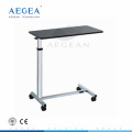 AG-OBT014 material de acero del hospital superficie negra cuatro ruedas comprar mesa de cama